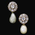 A pair of earrings suspending natural pearl drops, 19th century