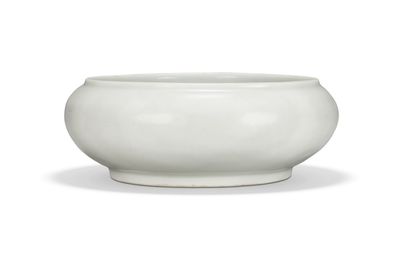 A very rare anhua-decorated tianbai-glazed ‘lotus scroll’ vessel, Ming dynasty, early 15th century