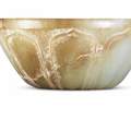 A pale celadon and russet jade ‘lotus’ bowl, Song dynasty or later
