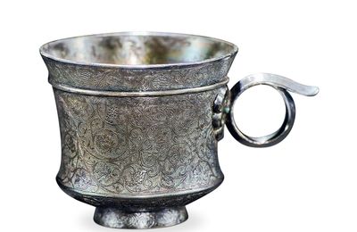 A small silver 'floral' cup, Tang dynasty (618-907)