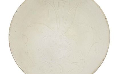A carved 'Ding' Lotus dish, Song Dynasty