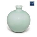 A rare celadon-glazed pomegranate-form vase, Qianlong seal mark in underglaze blue and of the period (1736-1795)