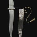 A rare Mughal gem-set jade-hilted dagger (peshkabz), North West India, 17th-18th century & A jade-hilted dagger, India,  18th ct