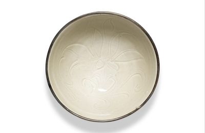 A small carved 'Ding' white-glazed 'lotus' bowl, Northern Song dynasty (960-1127)