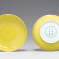 A pair of yellow-glazed incised dragon and phoenix dishes, Yongzheng six-character marks and of the period