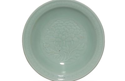 A carved celadon-glazed 'peony' dish, Qianlong period (1736-1795), Xuhuatang zhi hall mark within double squares