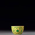 A small green-enamelled yellow-ground 'lotus' cup, Yongzheng six-character mark and of the period (1723-1735)