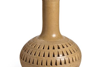 A rare and massive ash-glazed proto-porcelain reticulated globular vase, Eastern Zhou dynasty, Warring States period, 4th-3rd Ce
