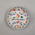 A Chinese Imperial porcelain wucai saucer dish.  Six-character mark of Jiajing within a double ring in underglaze blue, Kangxi, 