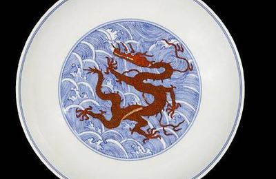 An iron-red and underglaze-blue 'dragon' dish. Qianlong six-character seal mark and of the period. 