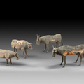 A herd of four painted wood figures of buffalos, Han dynasty (206 BC-220 AD)