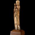 A carved ivory figure of Guanyin and child, Ming dynasty, 17th century