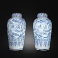 A rare pair of massive blue and white 'soldier' vases and covers, Kangxi