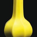 A small yellow glass fluted bottle vase. Qianlong incised four-character mark and of the period (1736-95)