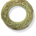 A finely carved yellow jade 'Chilong' disc, Song-Ming dynasty (960-1644)