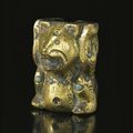 A turquoise-inlaid gilt-bronze 'Bear' fitting, Han dynasty (206 BCE-220 CE)