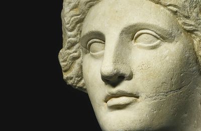 A Marble Head of a Woman, Queen, or Goddess, Egypt, Late Hellenistic, circa 1st Century B.C.