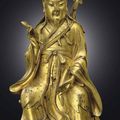 A very rare gilt-bronze figure of Lu Dongbin, Yuan-Early Ming Dynasty, 13th-14th century