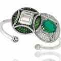  An Emerald, Demantoid Garnet and Diamond Bangle   