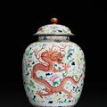 A finely painted and gilt-decorated famille-rose 'dragon and phoenix' jar and cover, Seal mark and period of Jiaqing