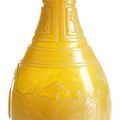 A carved semi-translucent amber yellow vase with archaistic motifs, China, 19th-20th century