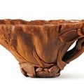 A finely carved rhinoceros horn 'Lotus leaf' libation cup, 17th century