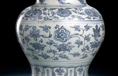 A blue and white porcelain jar 'guan' with flowers and Buddhist emblems, early Ming dynasty