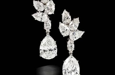 A 1967 pair of diamond pendant earrings & A diamond solitaire ring, Harry Winston