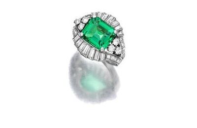 An emerald and diamond ring