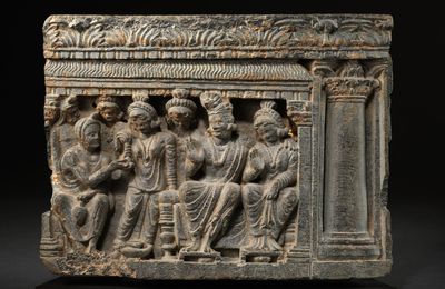 A grey schist relief panel of a bodhisattva making offerings, Ancient region of Gandhara, circa 3rd century