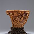 A rare and superbly carved 'Orchid Pavilion' rhinoceros horn libation cup. Ming dynasty, early 17th century