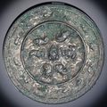 A bronze 'Lion and grapevine' mirror, Tang dynasty (618-907)