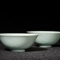 A very rare pair of celadon-glazed 'bat' bowls, Marks and period of Yongzheng