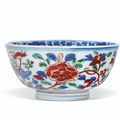 A wucai 'peony' bowl, Wanli six-character mark in underglaze blue within a double circle and of the period (1573-1619)
