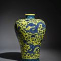 A rare and impressive yellow-ground green-enameled blue and white 'dragon' meiping, Qing dynasty, Qianlong period