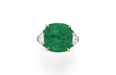 A cushion-cut emerald and diamond ring