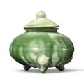 A small green-splashed pottery tripod censer and cover, Tang dynasty (618-907)
