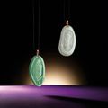 Fine pair of icy jadeite 'Guanyin' pendants
