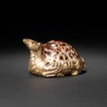 A gilt-bronze and tiger-cowrie-shell 'deer' mat weight. Western Han Dynasty