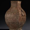 An important and very rare inlaid bronze facted jar, fanghu, Warring States period, 4th-3rd century BC