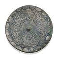 A silvery bronze circular 'Dragon' mirror, Mid Western Han dynasty, 3rd-2nd century BC