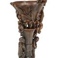 An extremely rare archaistic 'lotus and boys' rhinoceros horn libation cup, 17th-18th century