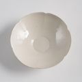 A fine light cream glazed blossom-shaped Ding bowl, Song dynasty (960-1279)