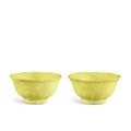 A very rare and fine pair of lemon-yellow 'mallow' cups, Marks and period of Yongzheng (1723-1735)