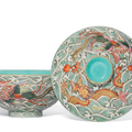 A moulded famille rose 'dragon and phoenix' bowl and cover, Qianlong-Jiaqing period (1736-1820)