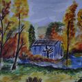 Une maison au bord d'un lac en automne