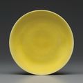 An imperial yellow-glazed dish, Zhengde six-character mark in underglaze blue within a double circle and of the period (1506-152