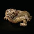 A rare and impressive painted wood figure of a mythical lion, Song dynasty (960-1279)