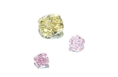 An unmounted fancy-coloured diamond & A pair of unmounted fancy-coloured diamonds