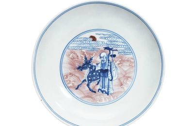 An underglaze blue and copper red 'immortals' dish, Yongzheng six character mark and of the period (1723-1735)